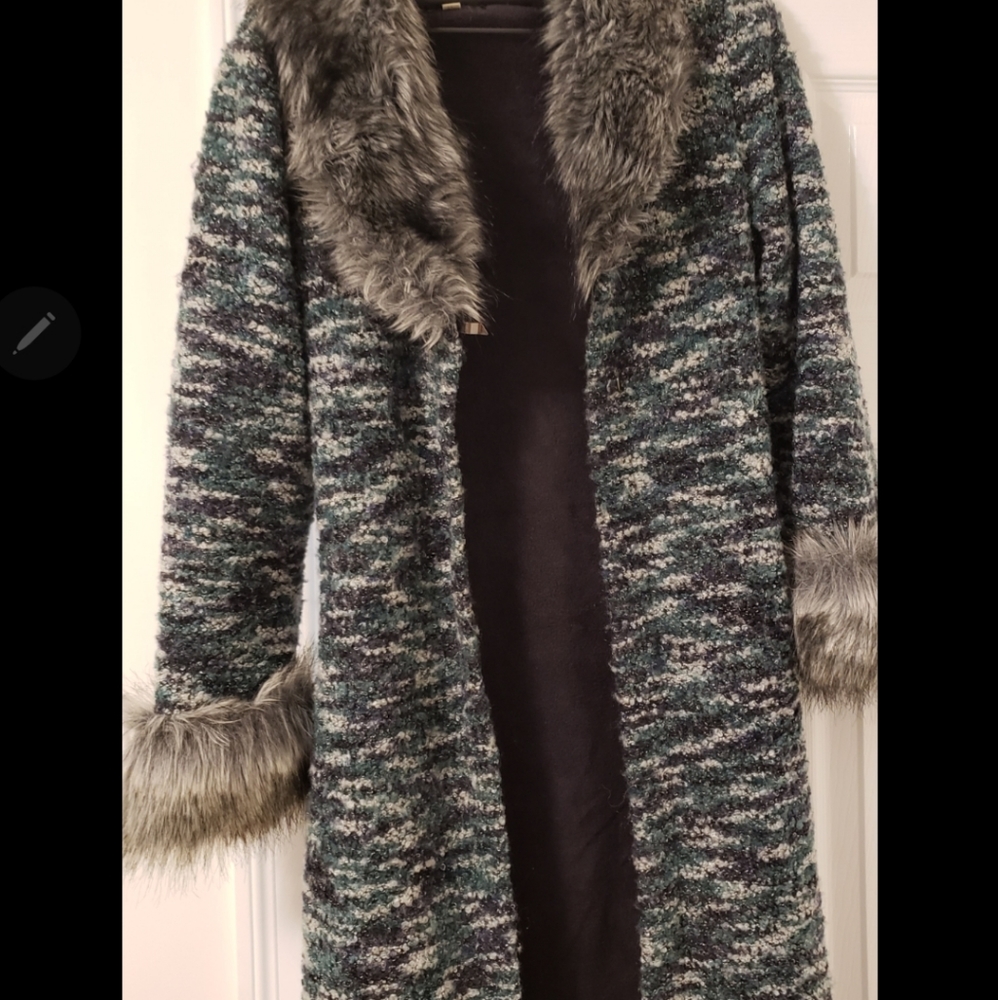 Long green coat.